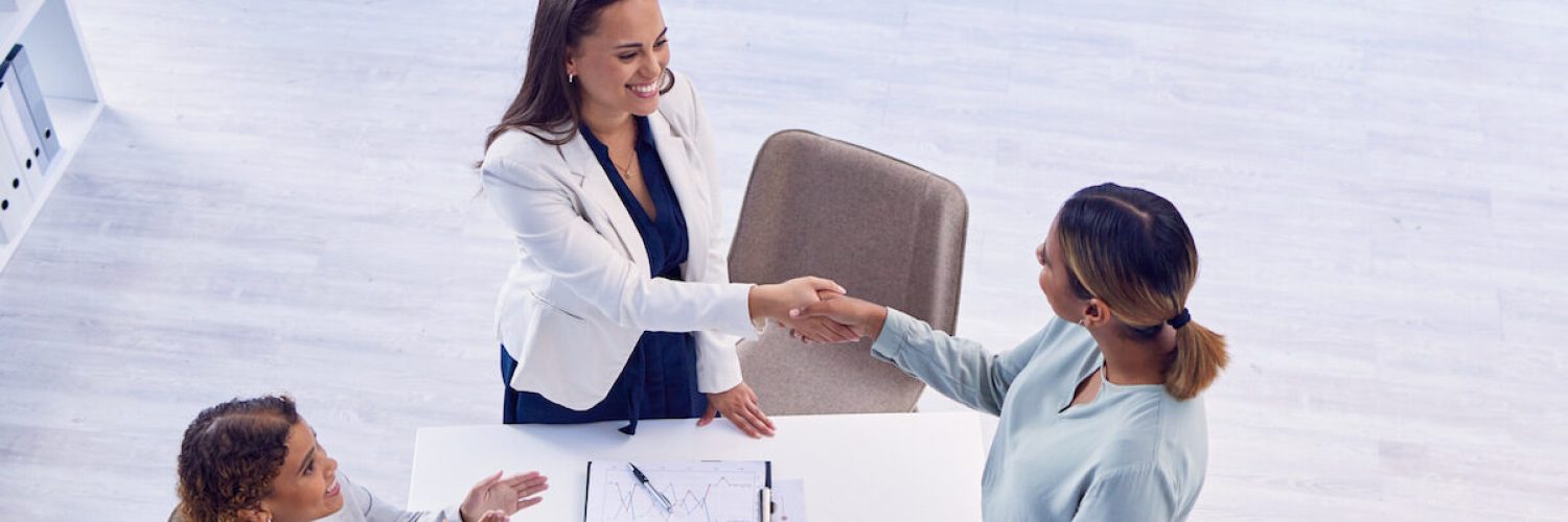 Handshake, applause and an overhead meeting in a boardroom for celebration of an achievement or pro.