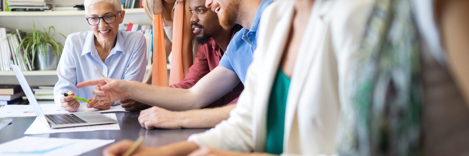 Cheerful coworkers, business people in office during company meeting